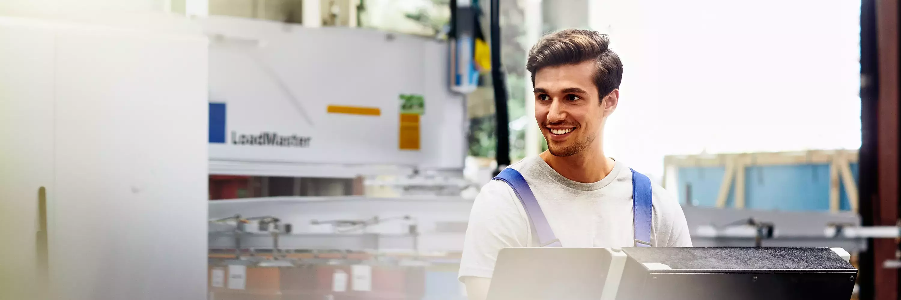 Smiling male on a production site